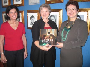 STTI Vice President Sherwood presenting Dr. Mendez STTI book